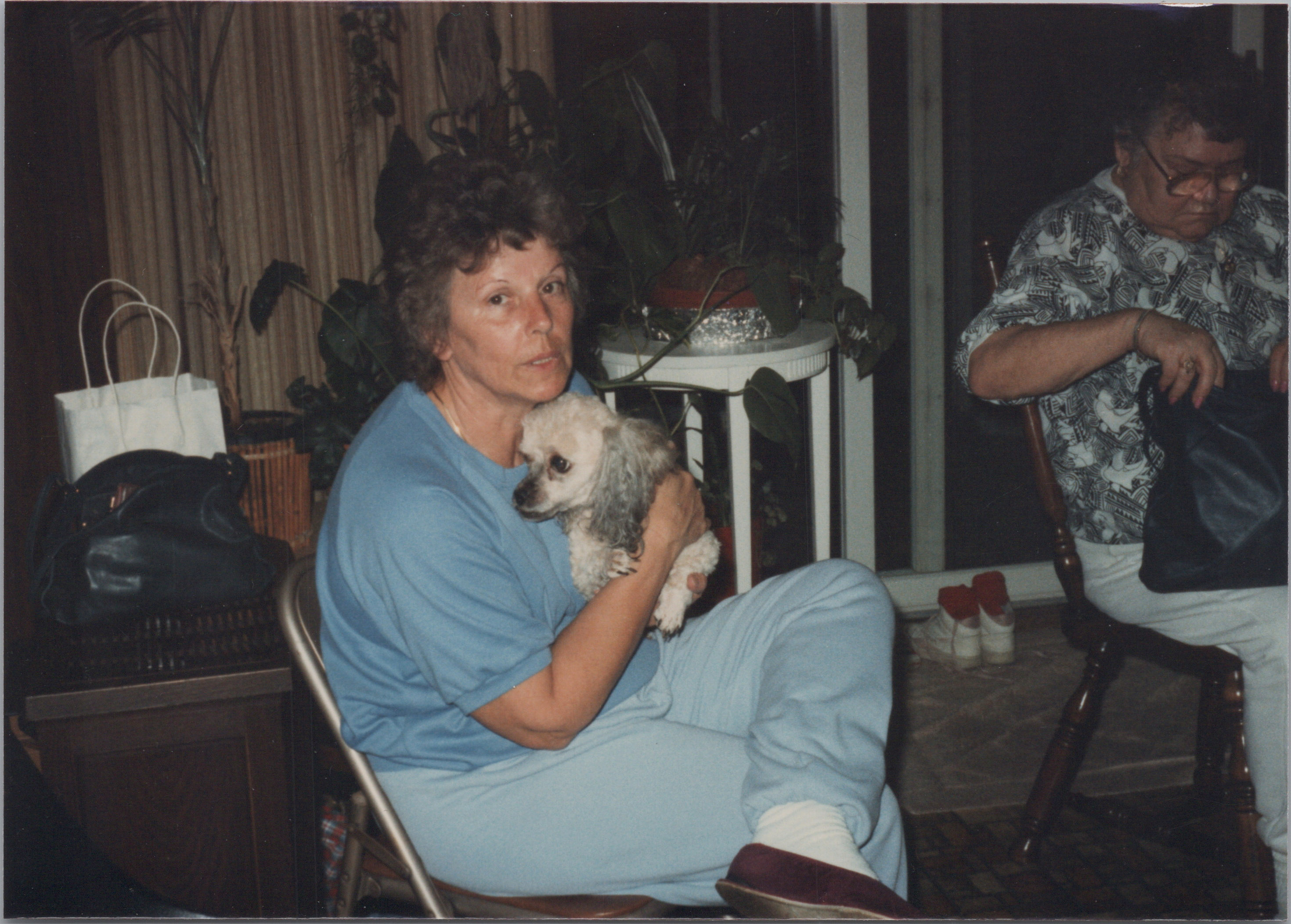 This is how she looks in my memory. Holding Ginger the poodle.